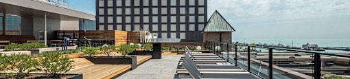 Chicago luxury apartment roof deck with seating and sun tanning chairs