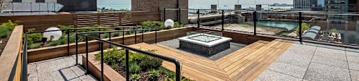 Chicago luxury apartment roof deck with seating and sun tanning chairs