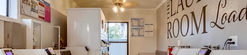 Laundry Care Center at The Village at South Coast Apartment Homes in Costa Mesa, California.