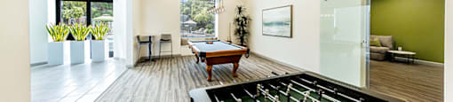 Lounge area with game tables at THE CLUBS AT RHODES RANCH APARTMENT HOMES, Nevada