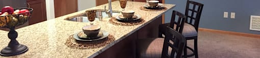 Gourmet Kitchens with Islands, Caesarstone Countertops, and Decorative Backsplash at Paragon Place at Bishops Bay, 5240 Bishops Bay Parkway, Wisconsin
