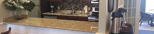 Gourmet Kitchens with Islands, Caesarstone Countertops, and Decorative Backsplash at Nicolet Highlands Apartments 55+, Wisconsin, 54115