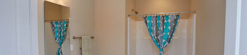 a bathroom with a sink toilet and a shower