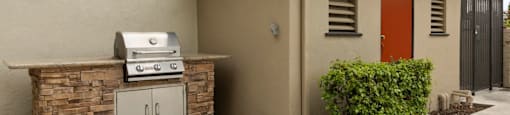 Apartments for Rent in Van Nuys - Colonial Manor - Built-in Barbeque Grill, Small Shrubs, and Outdoor Entrance