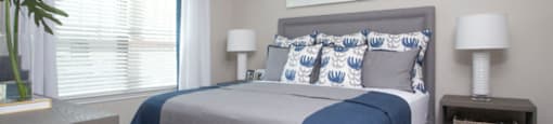 a bedroom with a bed and a ceiling fan