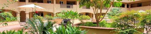 Courtyard with seating at KLIMPEL MANOR Apartments, Fullerton, California