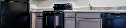Black Appliances at Williamsburg Apartments, Texas, 75051