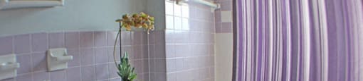 a bathroom with a toilet, sink, and bathtub  at Valley York Apartments, Parma Heights, OH, 44130