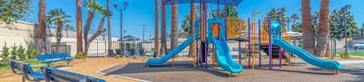 Playpark view with benches at Serrano Apartments, California, 91790