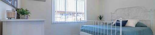 bedroom with to outside at Serrano Apartments, West Covina