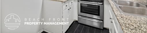 A kitchen with white cabinets and a granite countertop.
