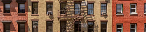 A building with a fire escape on the side.