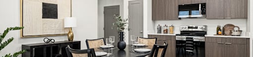 a kitchen and dining room with a table and chairs