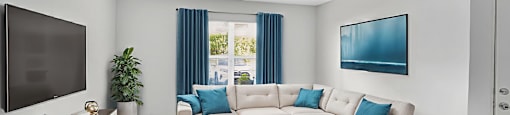 A living room with a white couch and a television. at Cascades at Clear Lake Apartments, Ft. Myers, 33908
