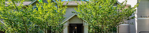 exterior entrance to property surrounded by trees