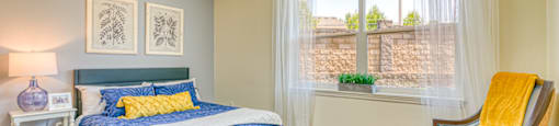 bedroom with open window and large bed
