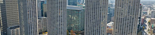 an aerial view of a city skyline with tall skyscrapers at Presidential Towers, Illinois, 60661