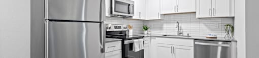 Modern Kitchen with Stainless Steel Appliances at Veranda La Mesa Apartments in La Mesa, CA 91942
