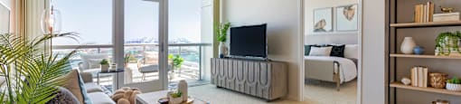 a living room with a couch and a tv  at Vue, California, 90731