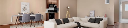 an open living room and dining room with a couch and a table