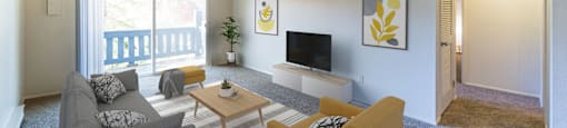 a living room with couches and a table and a television