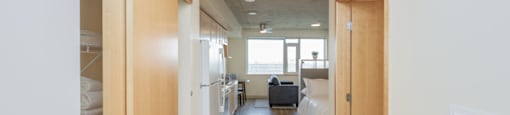 A long hallway with beds on either side.
