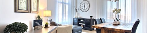 La Voile Boisbriand living area featuring large floor to ceiling windows in Boisbriand, QC