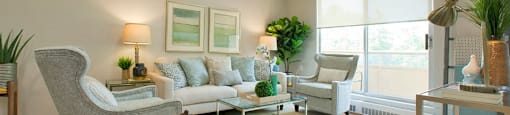 Acton Apartments living room with hardwood flooring and access to balcony in Acton, ON
