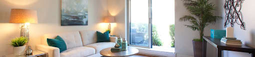 Oakdale Heights large, stylish living room with access to balcony in St. Catharines, ON