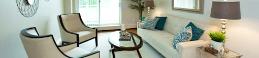 Lord Simcoe Apartments bright, spacious living room with access to balcony in
