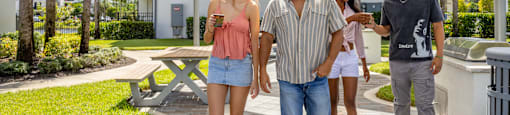 Group of people walking in a park-like setting at Portofino Vineyards, Fort Myers, 33967