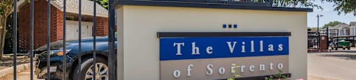 a sign for the villas in front of a driveway at Villas of Sorrento Apartments, Dallas, 75241