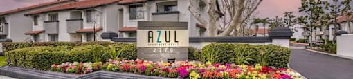 Monument sign with twilight at Azul Apartments, California