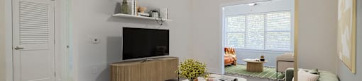 a living room with a couch and a tv