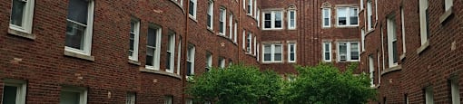 Historic brick exterior with a lovely courtyard