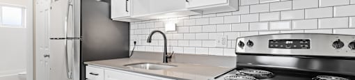 Effortlessly functional—streamlined counter space and crisp cabinetry keep things clean and modern at 1303 Columbine in Denver, CO