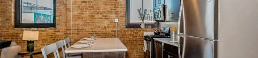 Kitchen with a breakfast bar at Carriage House Lofts, Chicago, IL