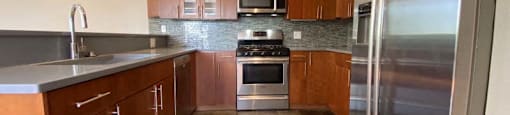 Gorgeous kitchen space with tile flooring and stainless steel appliances
