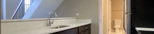 Gorgeous kitchen with stainless steel appliances and dark cabinetry