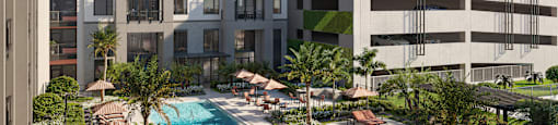 A modern building with a pool in front.