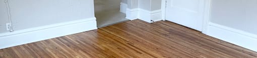 Spacious living room with hardwood flooring.