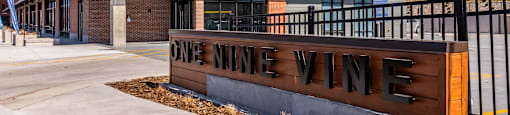 A sign that says One Nine Wine in front of a building.