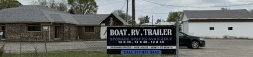 Sign for Boat RV Trailer is displayed in front of a building.