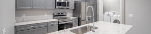 a view of a kitchen with white tiled flooring at Inspiration Apartments, Cottonwood, AZ, 86326