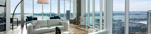 A modern living room with a view of the cityscape.