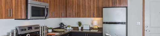 Fully Equipped Kitchen With Modern Appliances at Tivalli Apartments, Lynnwood, WA