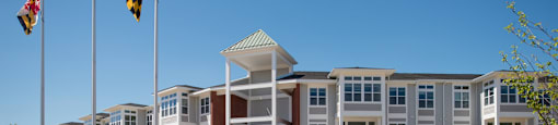 A large building with a flagpole in front of it.