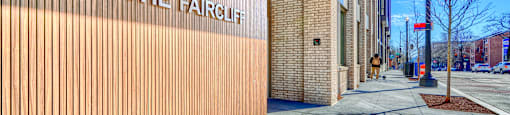 The Faircliff building has a wooden wall and a brick wall.