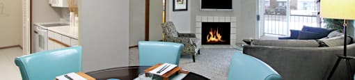Spacious floor plan, open floor plan, spacious apartment with woodburning fireplace, spacious kitchen, spacious dining room, and bright white kitchen at The Vanderbilt Apartments in Omaha, Nebraska