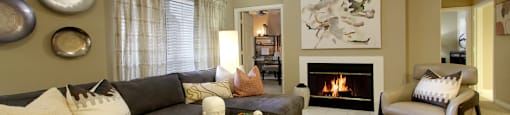 a living room with a couch and a fireplace